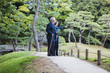 © Monet - 日本庭園を散歩するお爺さんとお婆さん。