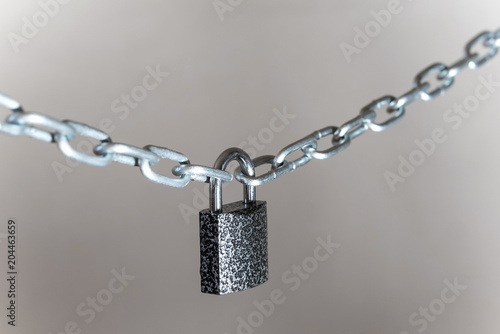 closeup on padlock locking the chain on grey background Poster