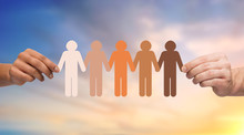 Population, Race And Ethnicity Concept - Multiracial Couple Hands Holding Chain Of People Pictogram Over Evening Sky Background