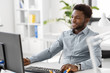 © Syda Productions - business, people and technology concept - african american businessman with computer working at office