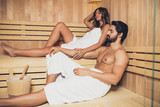 Beautiful couple relaxing in SPA sauna room