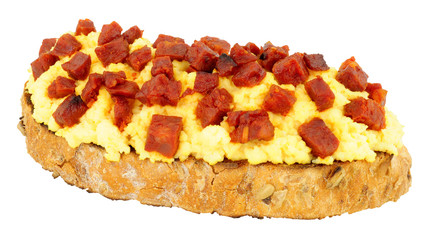 Wall Mural - Scrambled eggs with diced chorizo salami on toast isolated on a white background