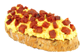 Wall Mural - Scrambled eggs with diced chorizo salami on toast isolated on a white background