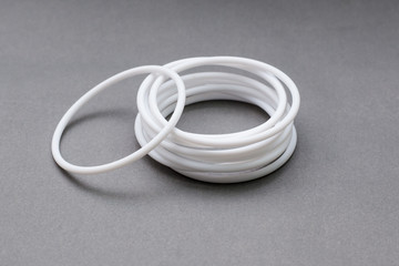 Teflon ring seals on gray background