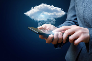 Businessman downloads the data from cloud .