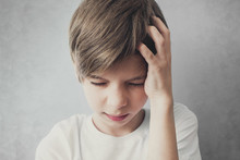 Portrait Of Boy With Headache