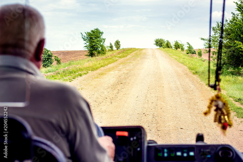 Fotografie, Obraz Rural road - view from window of bus, rural tourism_