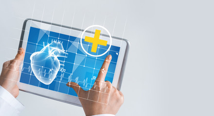 Close of female doctor hands working with tablet pc computer