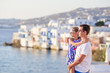 © travnikovstudio - Father and little girl background Little Venice in Mykonos