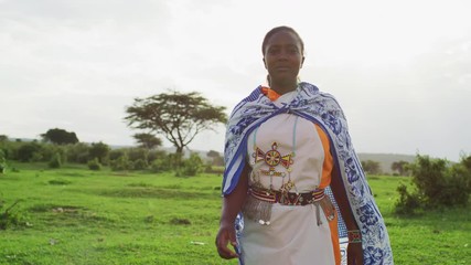 maasai woman walking on a field