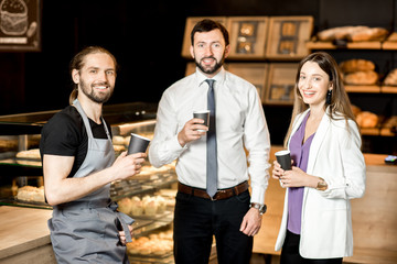 Wall Mural - Business couple with barista in the shop