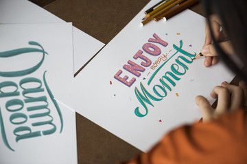 Sticker - An artist creating hand lettering artwork