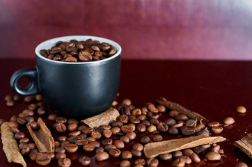 coffee beans, black Cup and cinnamon