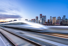 High Speed Train With Cityscape