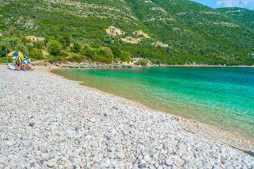 Crystal clear turquoise sea waters of a pebble beach. Poros beach in Lefkada ionian island in Greece