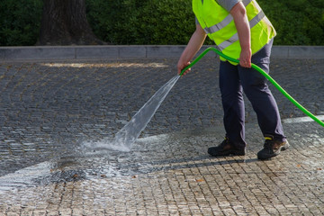 Wall Mural - Wet cleaning of street.