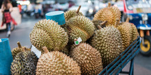 .Durians In The Asian Market Close-up. Sale Of Fruits Of Durian On A Cart