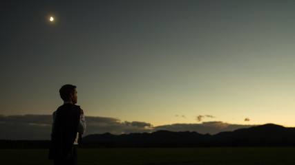 Wall Mural - Wide panorama view of businessman holding his jacket outside