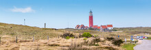 Panorama With Red Lighthouse At  Wadden Island Texel In The Netherlands Taken Form The Sand Dunes Of Teh Village Cocksdorp.