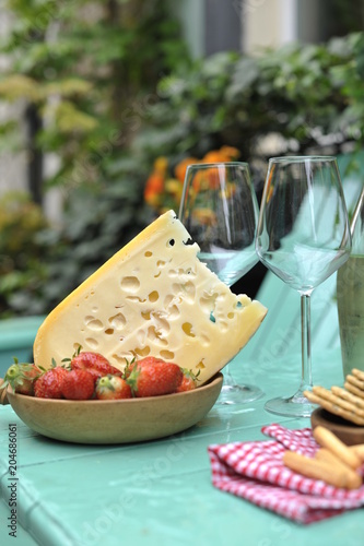 A Bottle Of White Wine And Two Glasses Dutch Cheese And Red