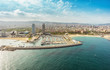 Barcelona skyline aerial view skyscrapers by the beach, Spain. Vintage colors