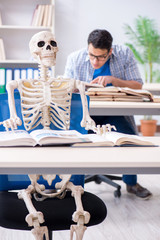 Wall Mural - Student skeleton listening to lecture in classroom