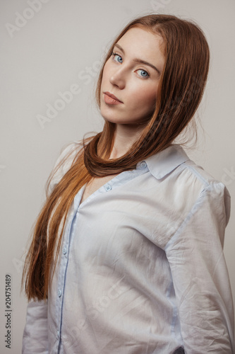 Attractive Redhaired Woman Tying Thick Ginger Long Hair Around