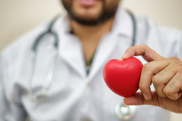 close up of doctor hands with heart