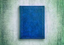 Mock Up Book Blue Color On Grunge Background Close-up, Top View