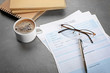 © Africa Studio - Resume forms, glasses and cup of coffee on table. Job interview