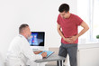 © New Africa - Man with health problem visiting urologist at hospital