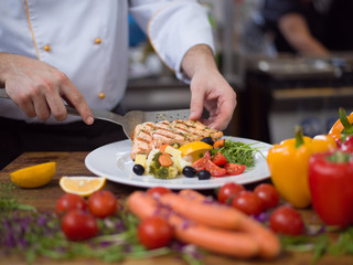 Canvas Print - cook chef decorating garnishing prepared meal