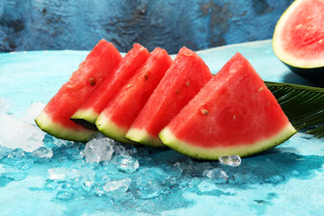 Wall Mural - watermelon on blue background. juicy summer fruit in slices