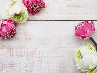 Wall Mural - pink lotus flowers on wooden table.