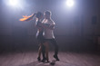 © satura_ - Active happy adults dancing bachata together in dance class