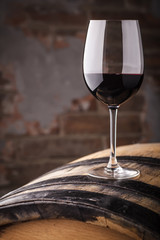 Wall Mural - Red wine on a barrel