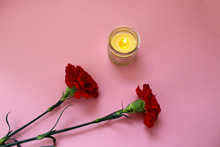 Mourning Two Carnations Red With A Candle