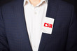 © Майя Руднева - Businessman shows business card with the inscription:CSR