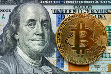 Golden Bitcoin Coin On Us Dollars Close Up. Electronic Crypto Currency