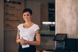 © Jacob Lund - Female waitress working in a restaurant