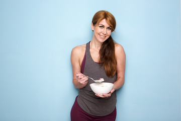 Fitness woman eating healthy breakfast