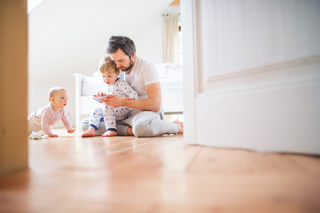 Wall Mural - Father and toddler children with smartphone at home at bedtime.