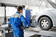 © Евгений Вдовин - mechanic working in a car workshop