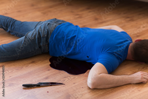 Murder Kill And People Concept Dead Man Body And Knife In Blood