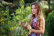 © Volodymyr Shcherbak - Portrait beautiful happy woman enjoying smell in a flowering spring blooming garden. Bright and fashionable smiling girl near blossom cherry tree