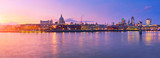 Fototapeta Londyn - Millennium Bridge leading to Saint Paul's Cathedral in central London at sunset