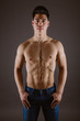 © Antonio Ovejero Diaz/ADDICTIVE STOCK - Handsome topless man standing in jeans