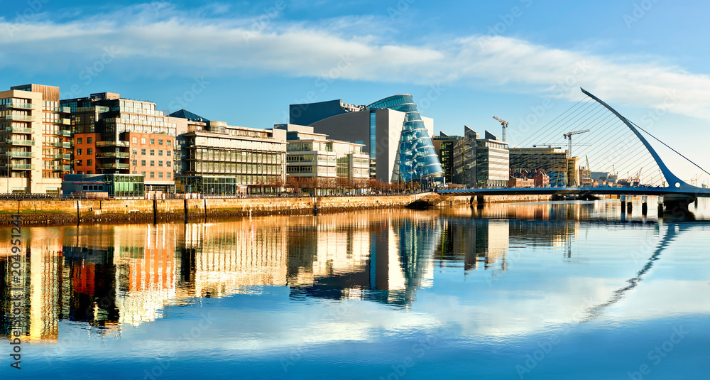 Obraz na płótnie Modern buildings and offices on Liffey river in Dublin on a bright sunny day w salonie