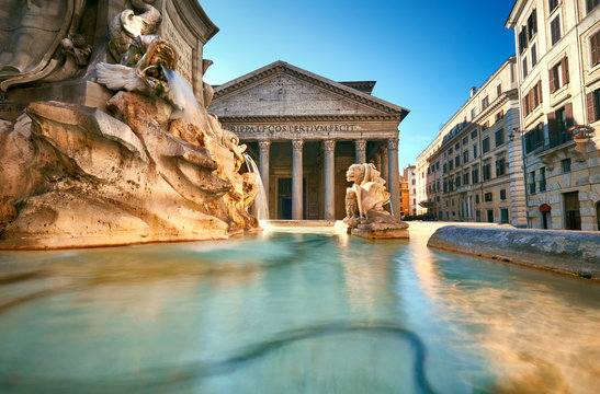 fountain on piazza della rotonda with parthenon behind, rome, italy