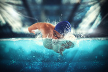 Athlete Swims In A Blue Deep Pool